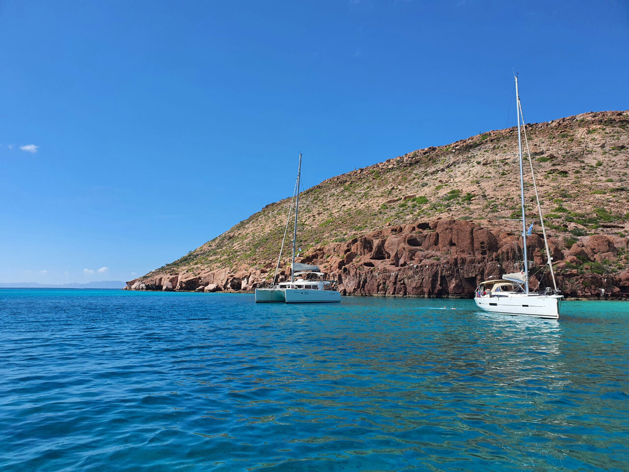 Sailing boat and catamaran anchored in Croatia